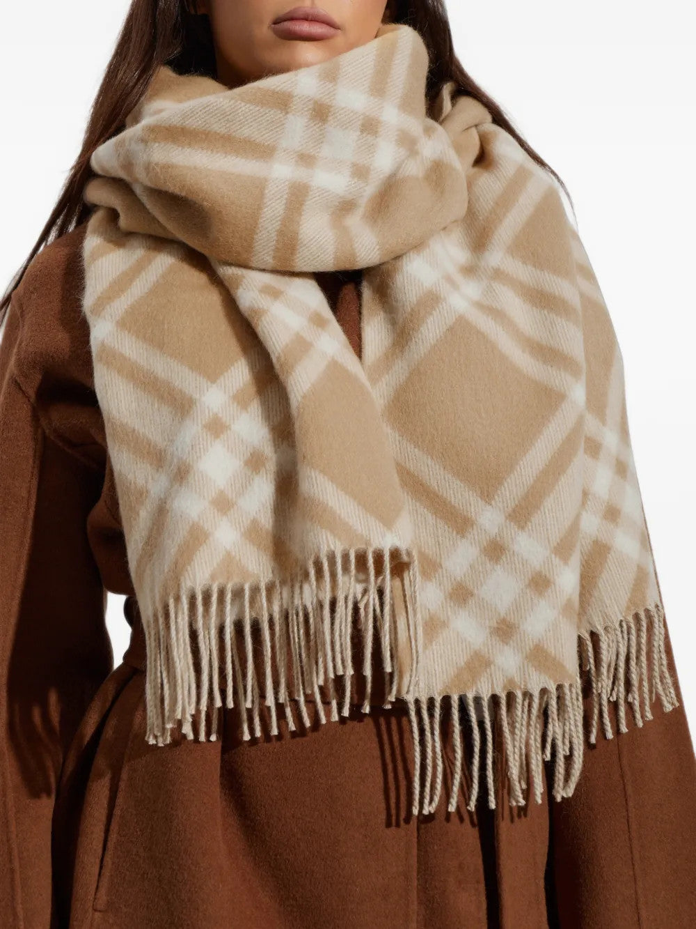 Tan scarf worn by a person, showing the scarf fit