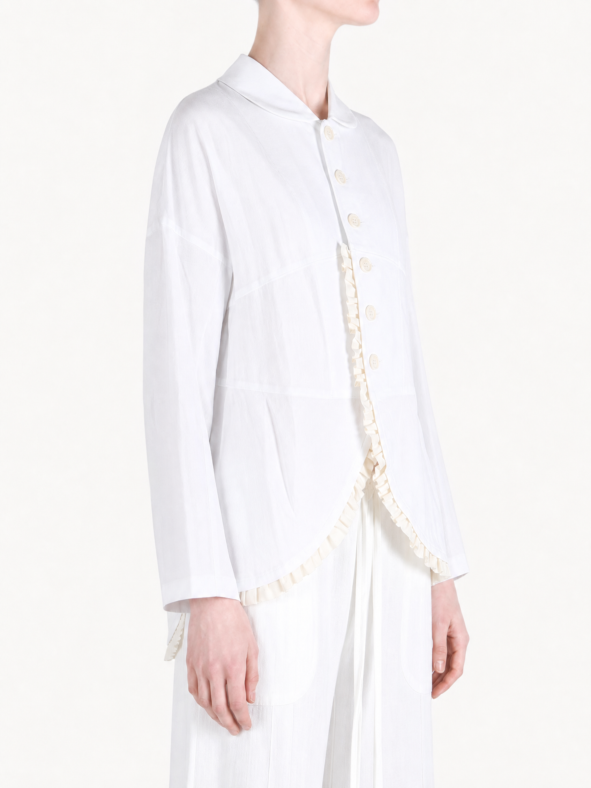 White jacket worn by a person, showing the jacket fit