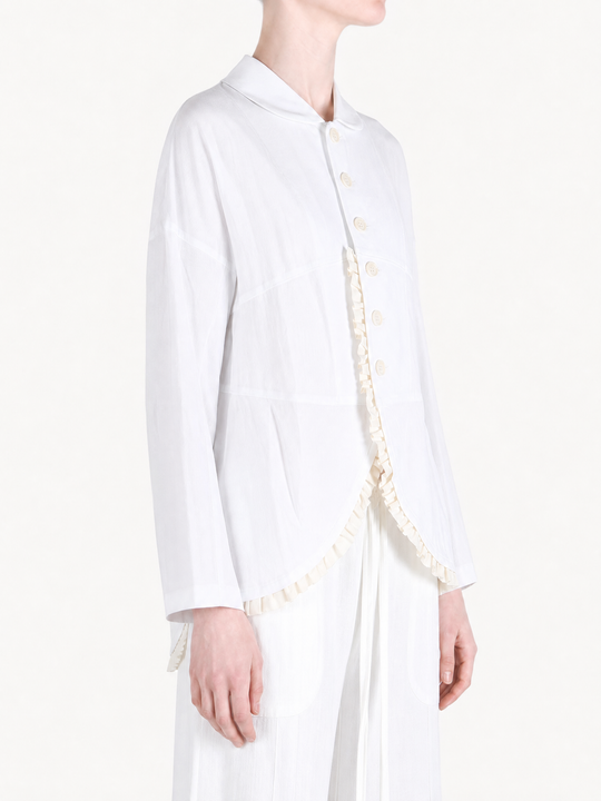 White jacket worn by a person, showing the jacket fit