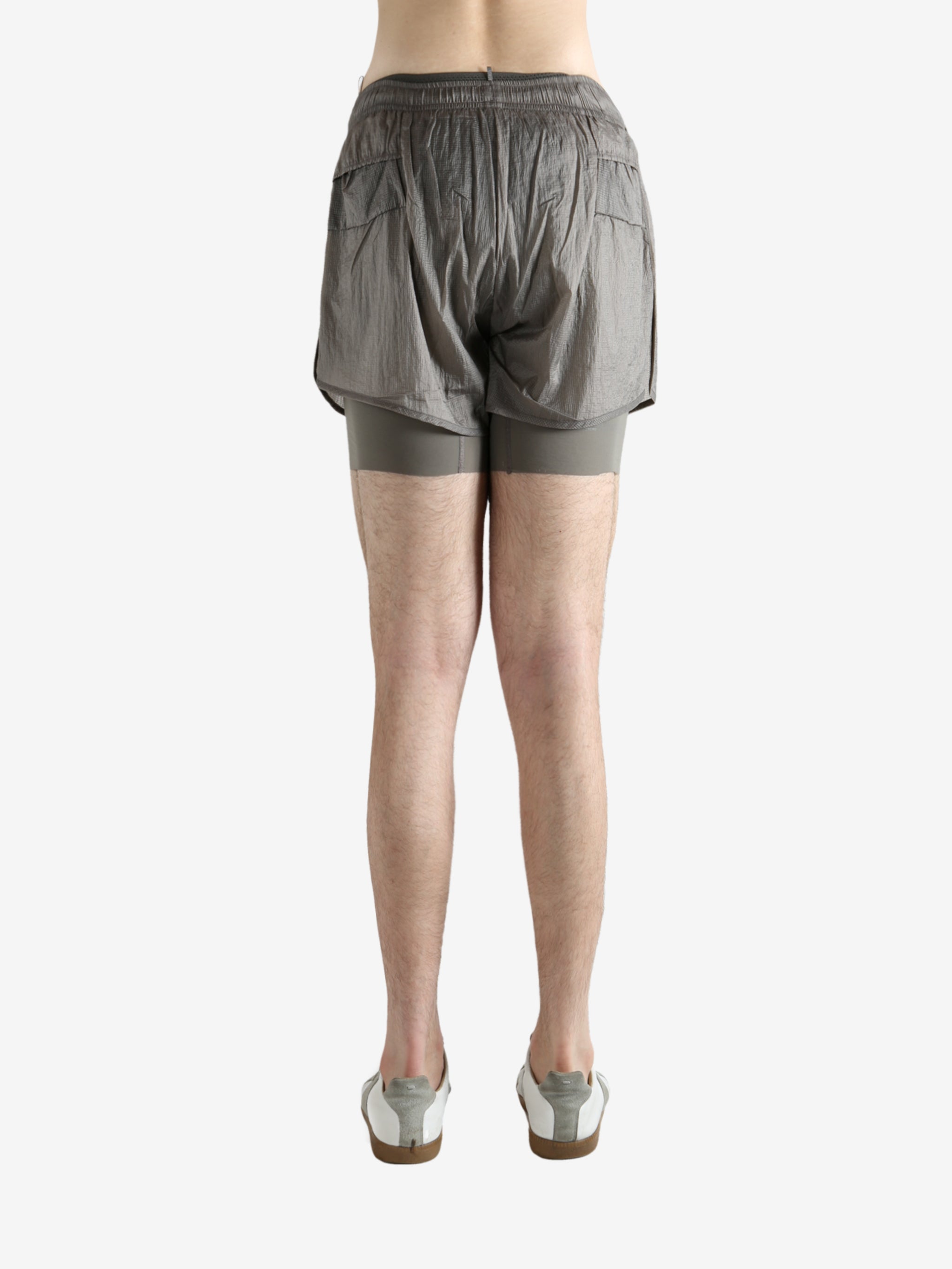 Grey shorts worn by a person, showing the shorts fit