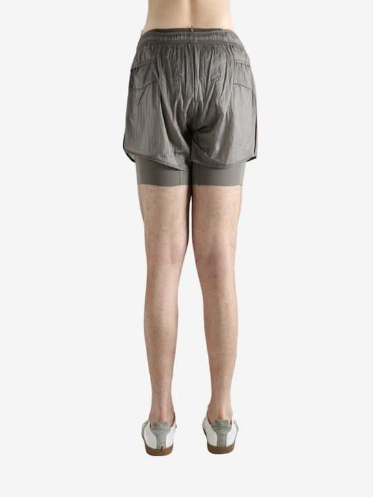 Grey shorts worn by a person, showing the shorts fit