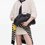 Black bags worn by a person, showing the bags fit