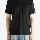 Black shirt worn by a person, showing the shirt fit