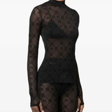 Black top worn by a person, showing the top's fit