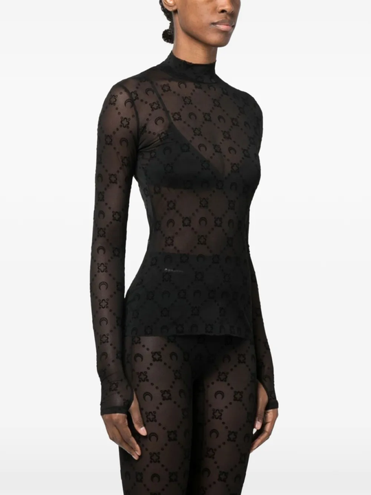 Black top worn by a person, showing the top's fit