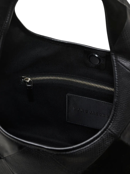 Close up of the black bag, showing texture of the leather fabric