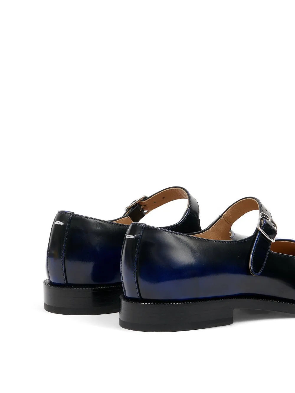 Close up of the black derbys, showing texture of the leather