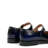 Close up of the black derbys, showing texture of the leather