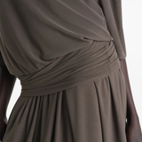 Close up of brown dresses, showing texture of the nylon fabric