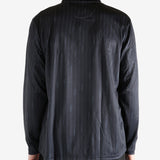 Black pullover worn by a person, showing the pullover's fit