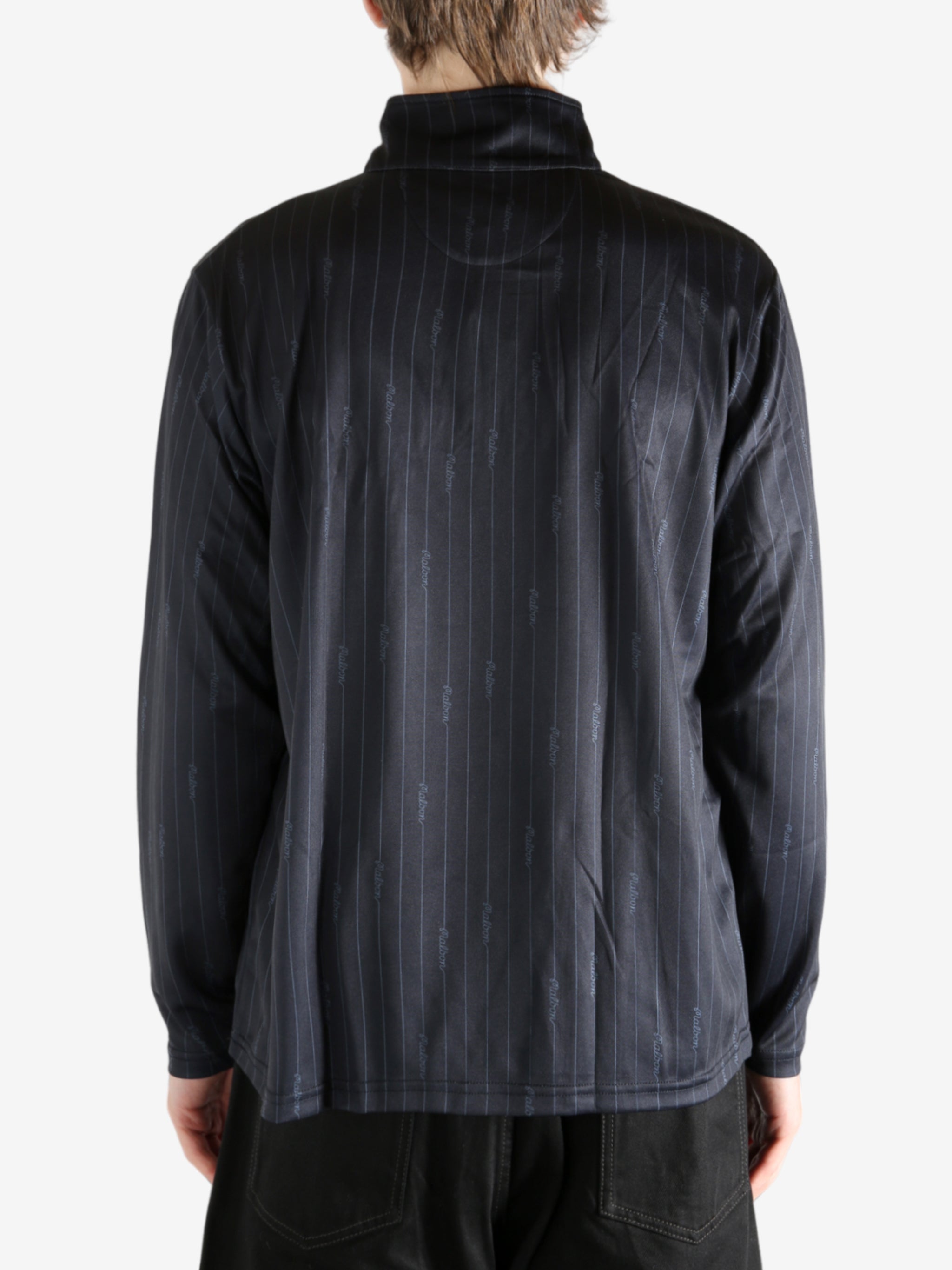 Black pullover worn by a person, showing the pullover's fit