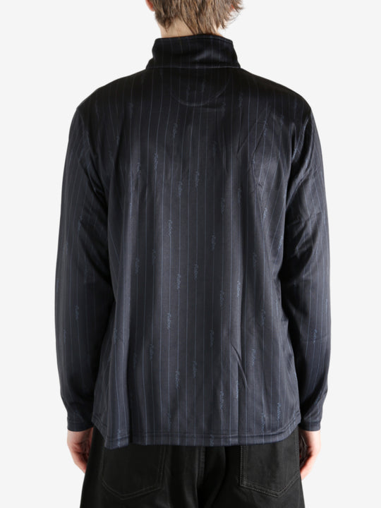 Black pullover worn by a person, showing the pullover's fit