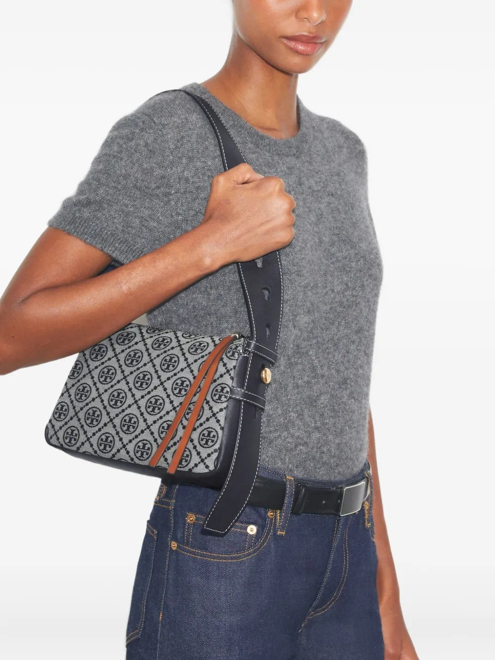 Navy bag worn by a person, showing the bag's fit