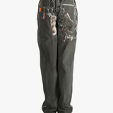 Grey pant worn by a person, showing the pant's fit