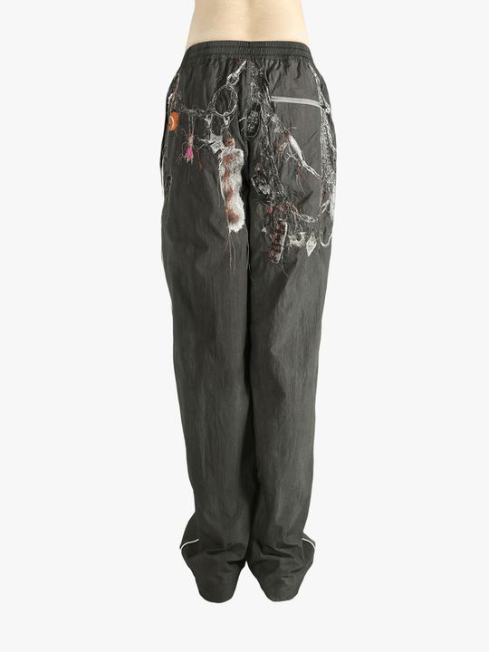 Grey pant worn by a person, showing the pant's fit