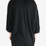 Black t-shirt worn by a person, showing the t-shirt fit