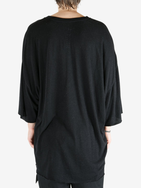 Black t-shirt worn by a person, showing the t-shirt fit