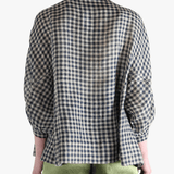 Black shirt worn by a person, showing the shirt's fit