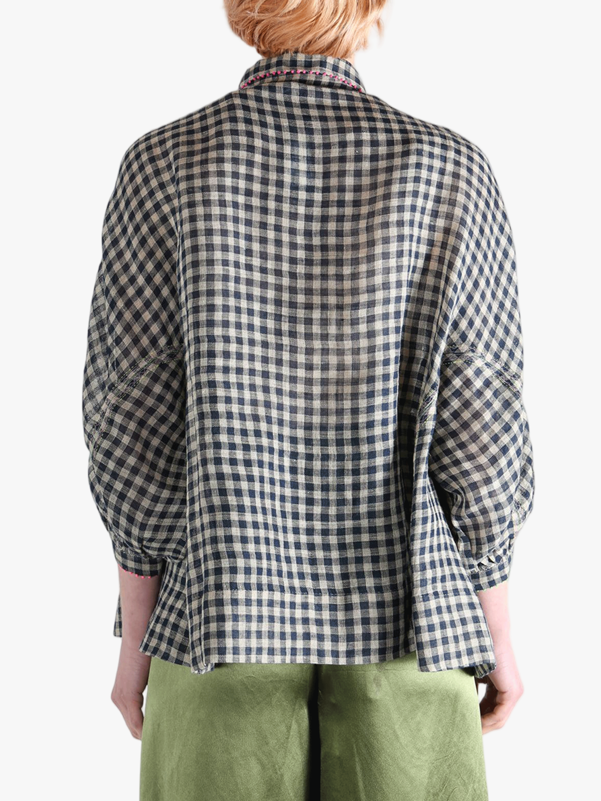 Black shirt worn by a person, showing the shirt's fit