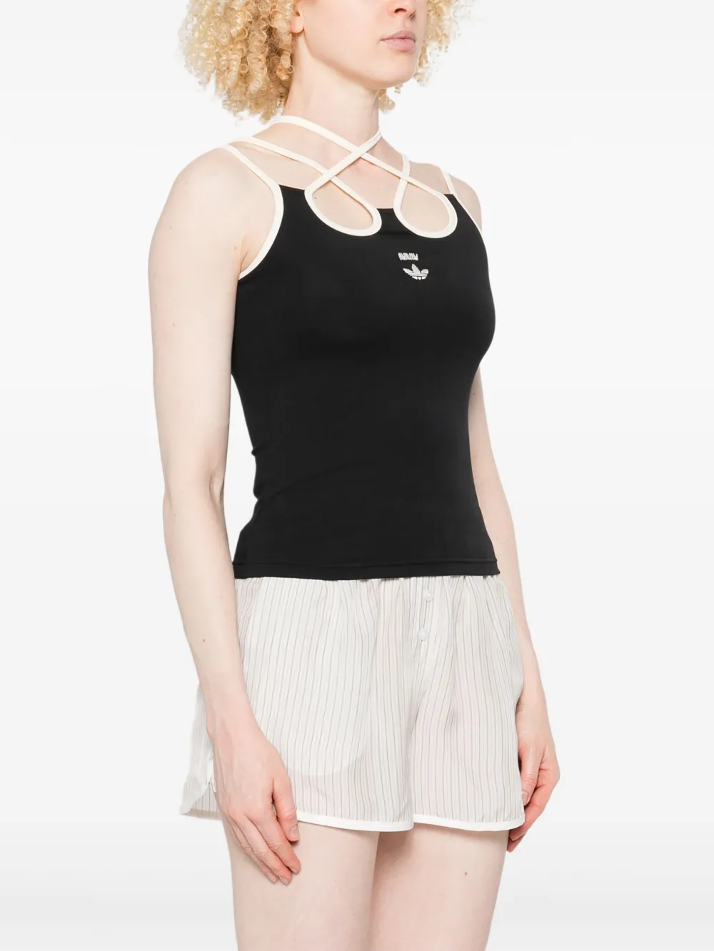 Black top worn by a person, showing the top's fit