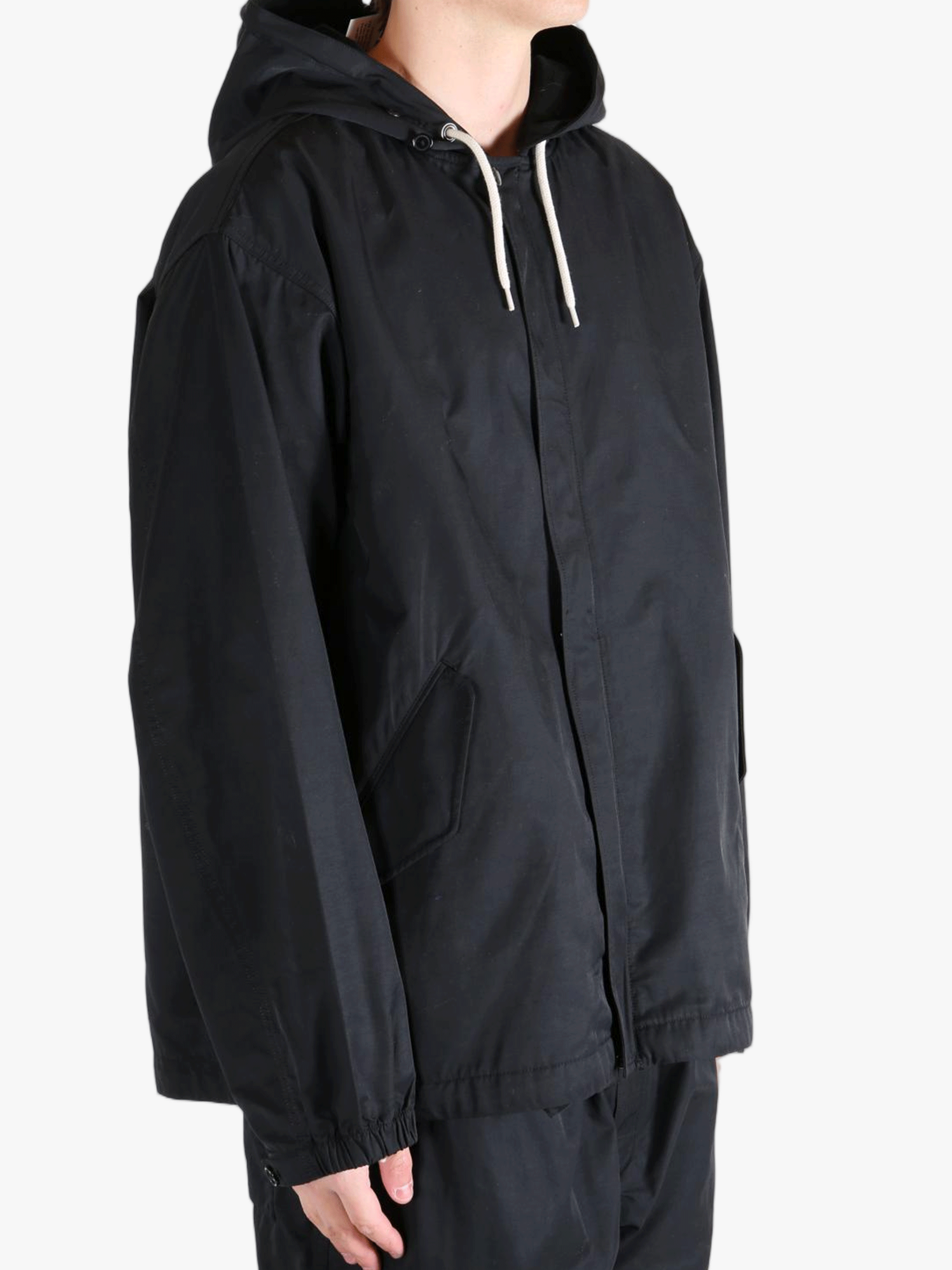 Black jackets worn by a person, showing the jackets fit