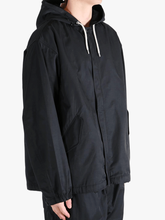 Black jackets worn by a person, showing the jackets fit