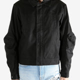 Black jacket worn by a person, showing the jacket's fit