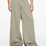 Grey pants worn by a person, showing the pants fit