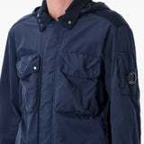 Close up of navy jacket, showing texture of the polyamide fabric