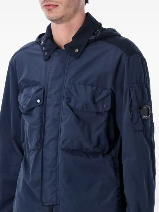 Close up of navy jacket, showing texture of the polyamide fabric