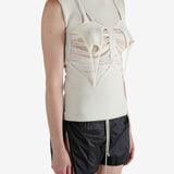 White top worn by a person, showing the top's fit