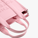 Close up of the pink bag, showing texture of the leather fabric