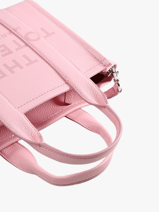 Close up of the pink bag, showing texture of the leather fabric