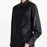Black shirt worn by a person, showing the shirt's fit