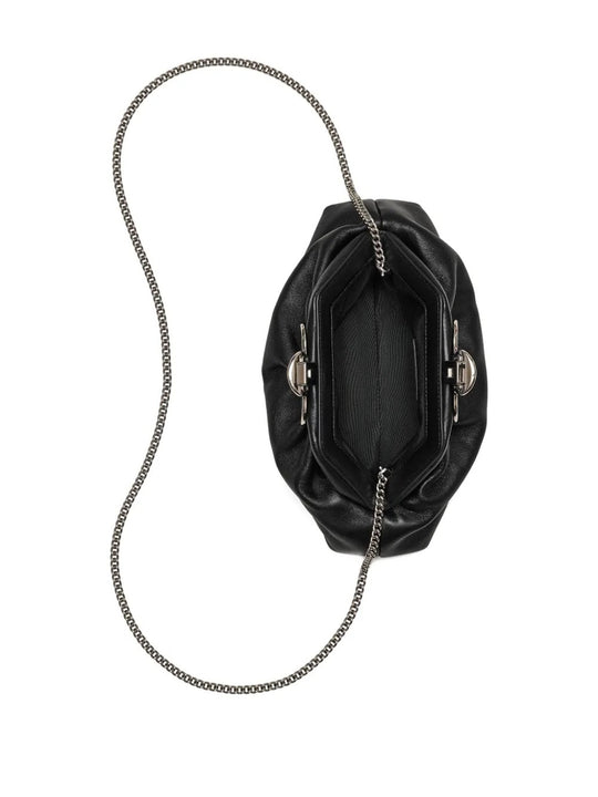 Close up of black bags, showing texture of the leather fabric