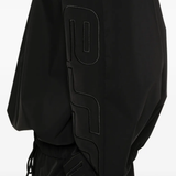 Close up of black coats, showing texture of the polyester fabric