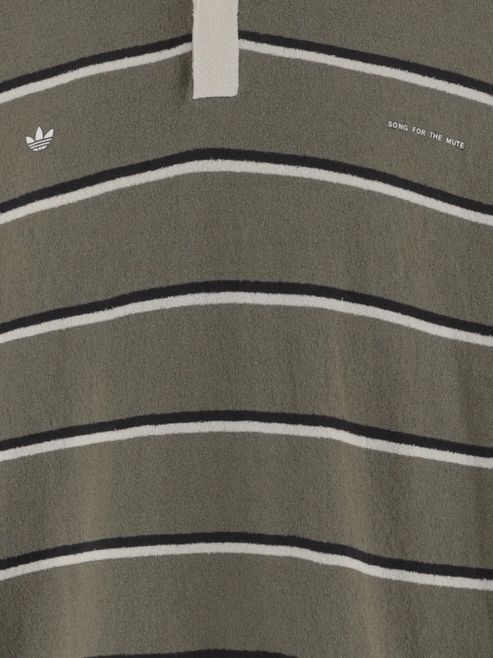 Close up of green t-shirts, showing texture of the cotton fabric
