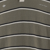 Close up of green t-shirts, showing texture of the cotton fabric
