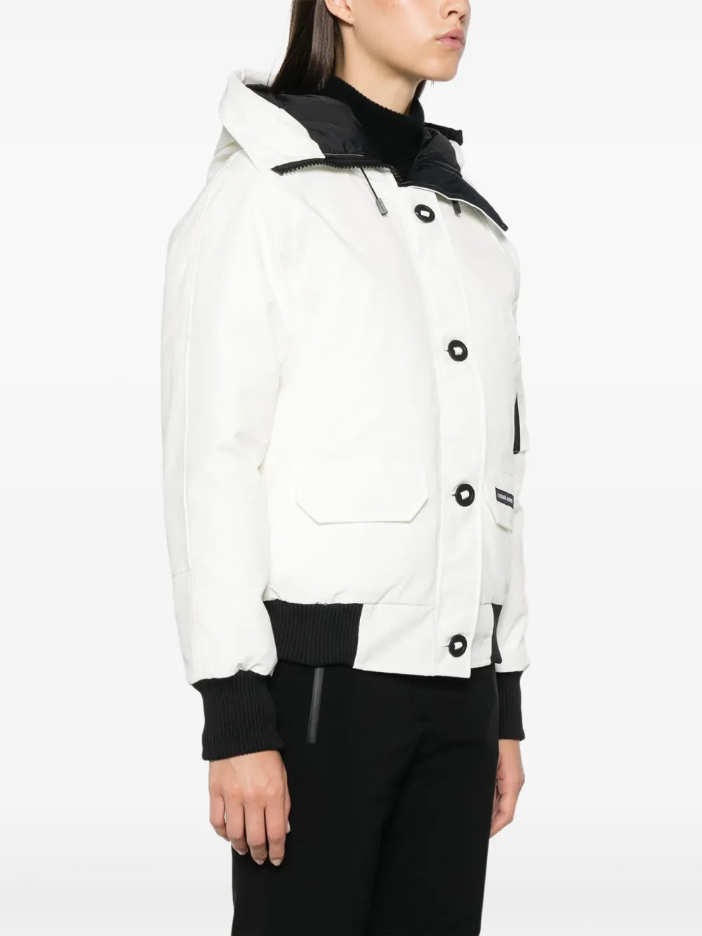 White jacket worn by a person, showing the jacket fit