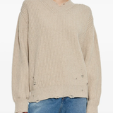 Tan sweater worn by a person, showing the sweater's fit