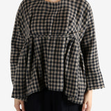 Navy shirt worn by a person, showing the shirt's fit