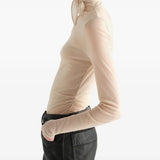 Tan top worn by a person, showing the top fit