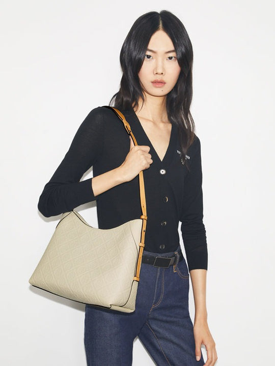 White bag worn by a person, showing the bag's  fit