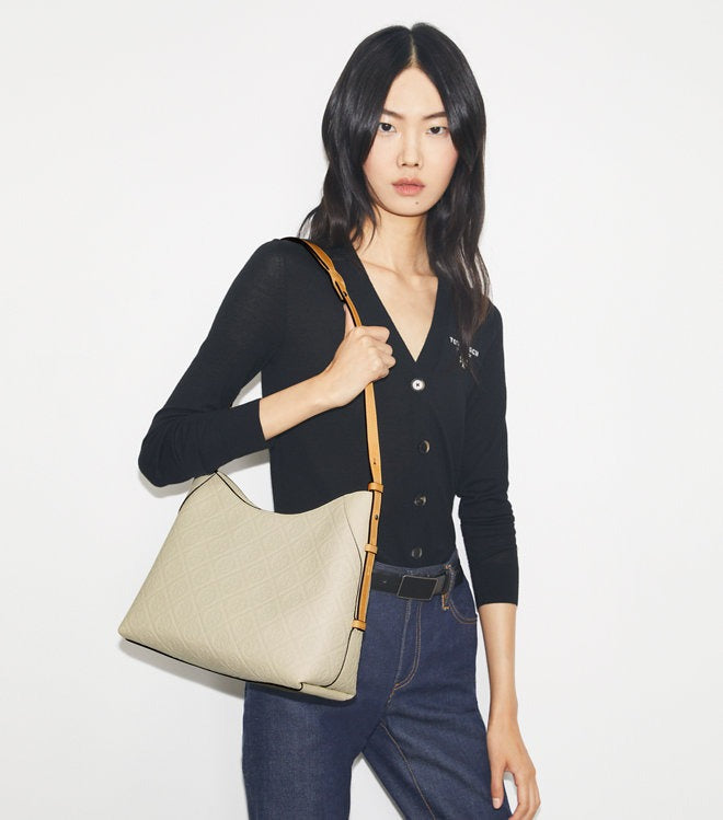 White bag worn by a person, showing the bag's  fit