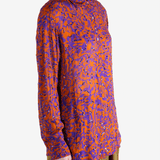 Red top worn by a person, showing the top fit