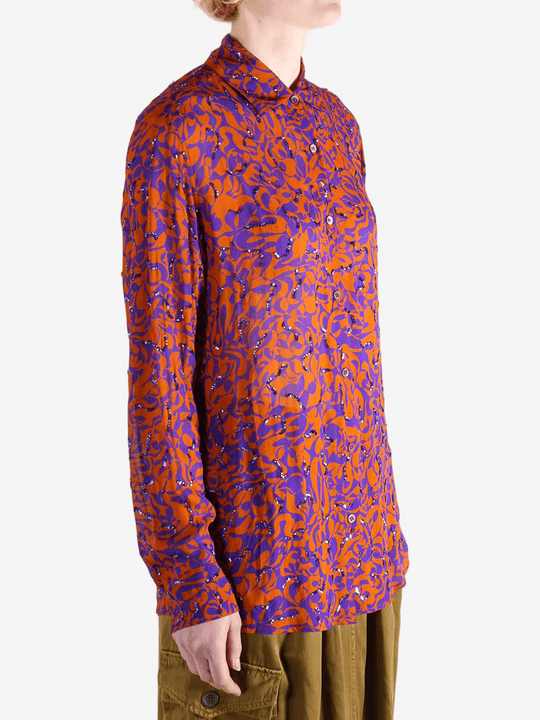 Red top worn by a person, showing the top fit