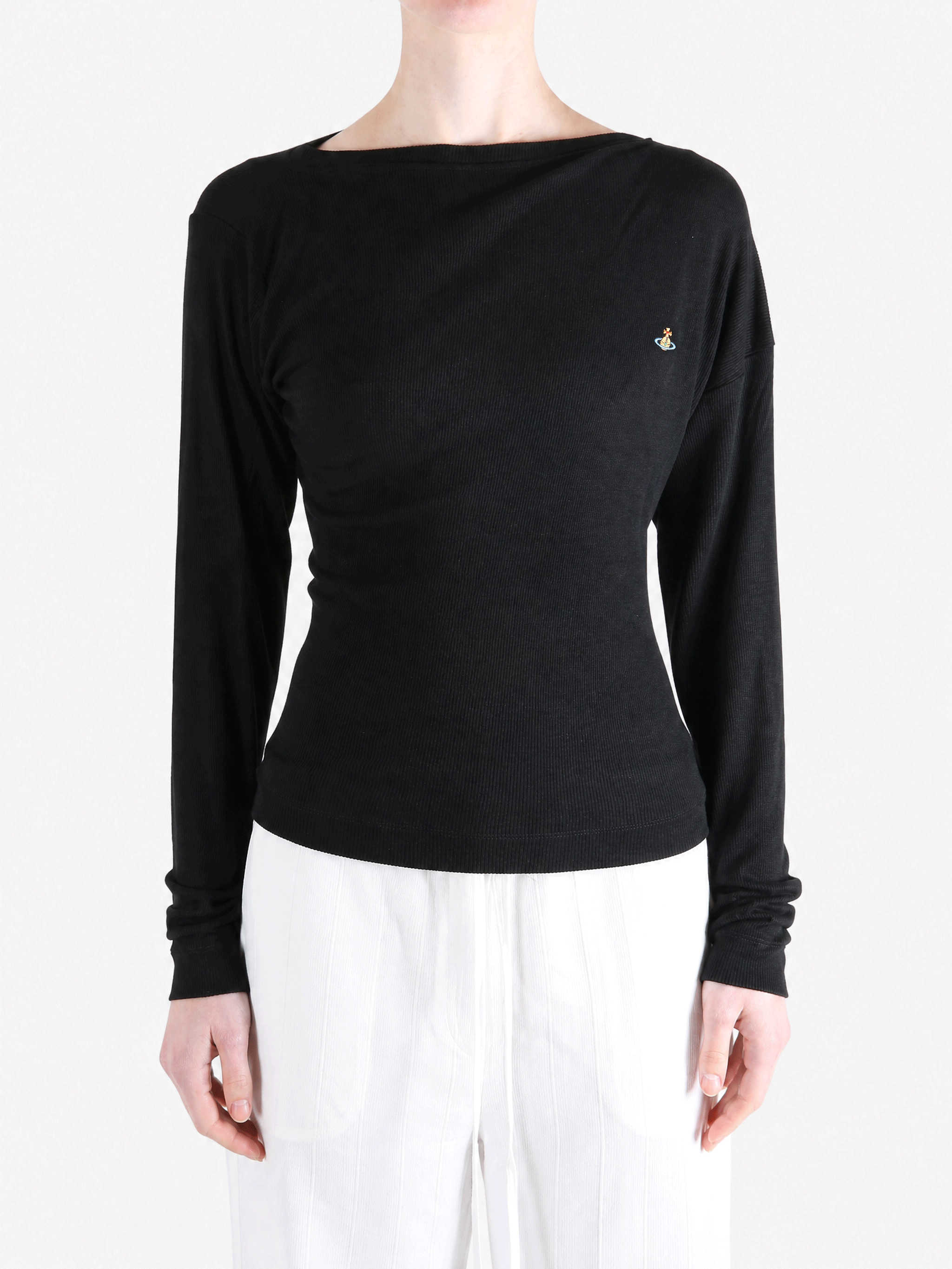 Black top worn by a person, showing the top fit