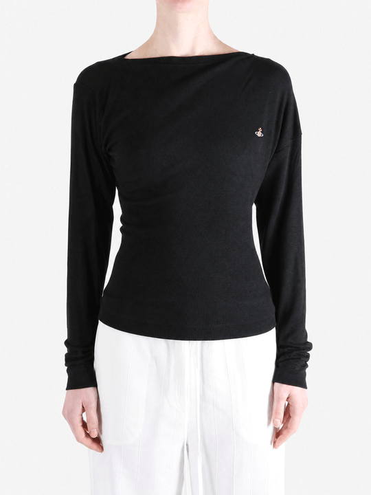 Black top worn by a person, showing the top fit