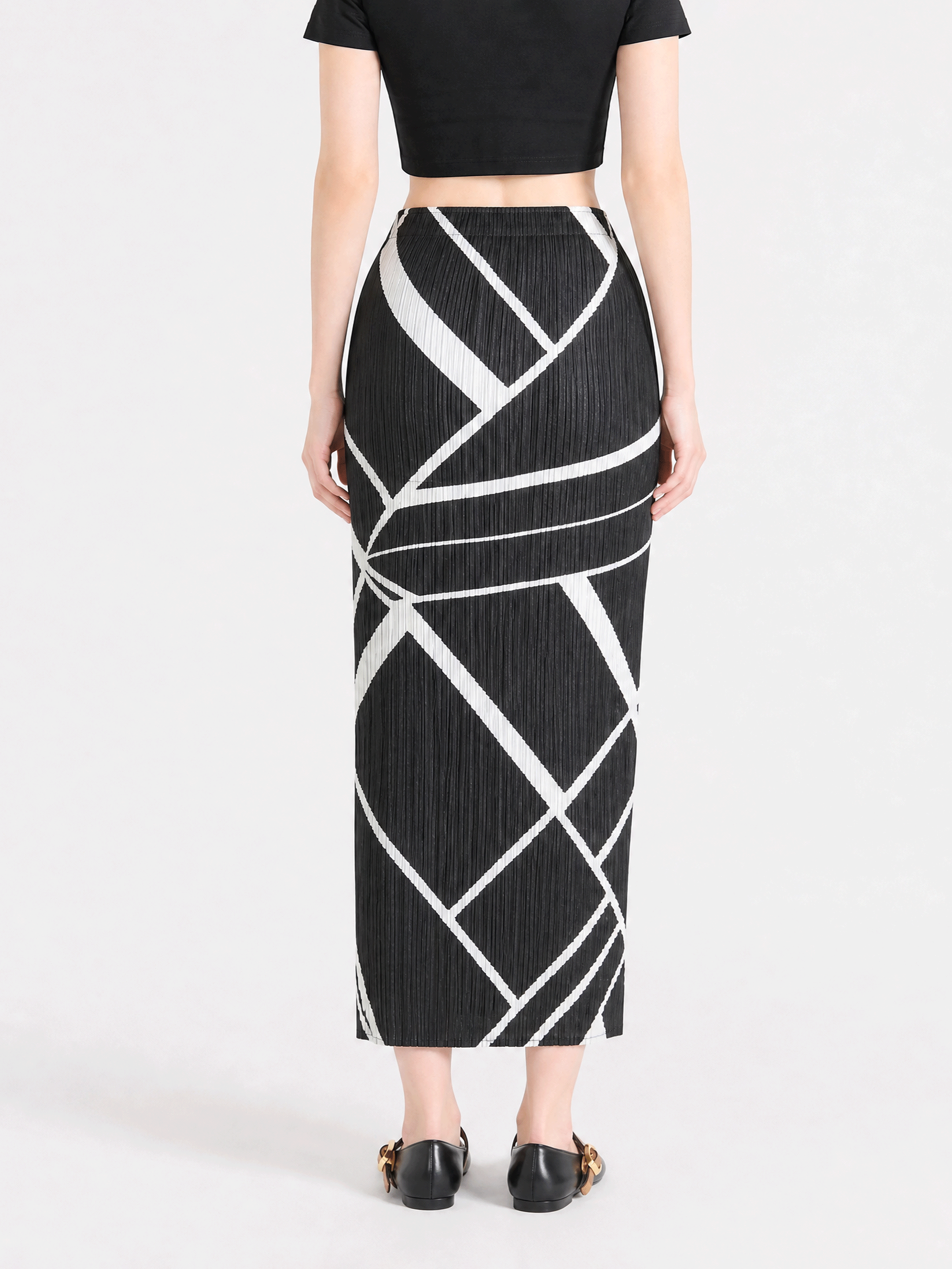 Black skirt worn by a person, showing the skirt fit
