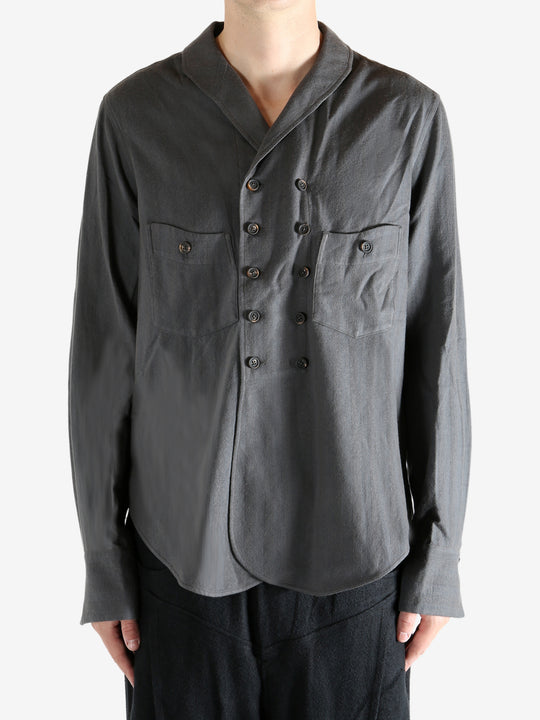 Grey shirt worn by a person. showing the shirt's fit